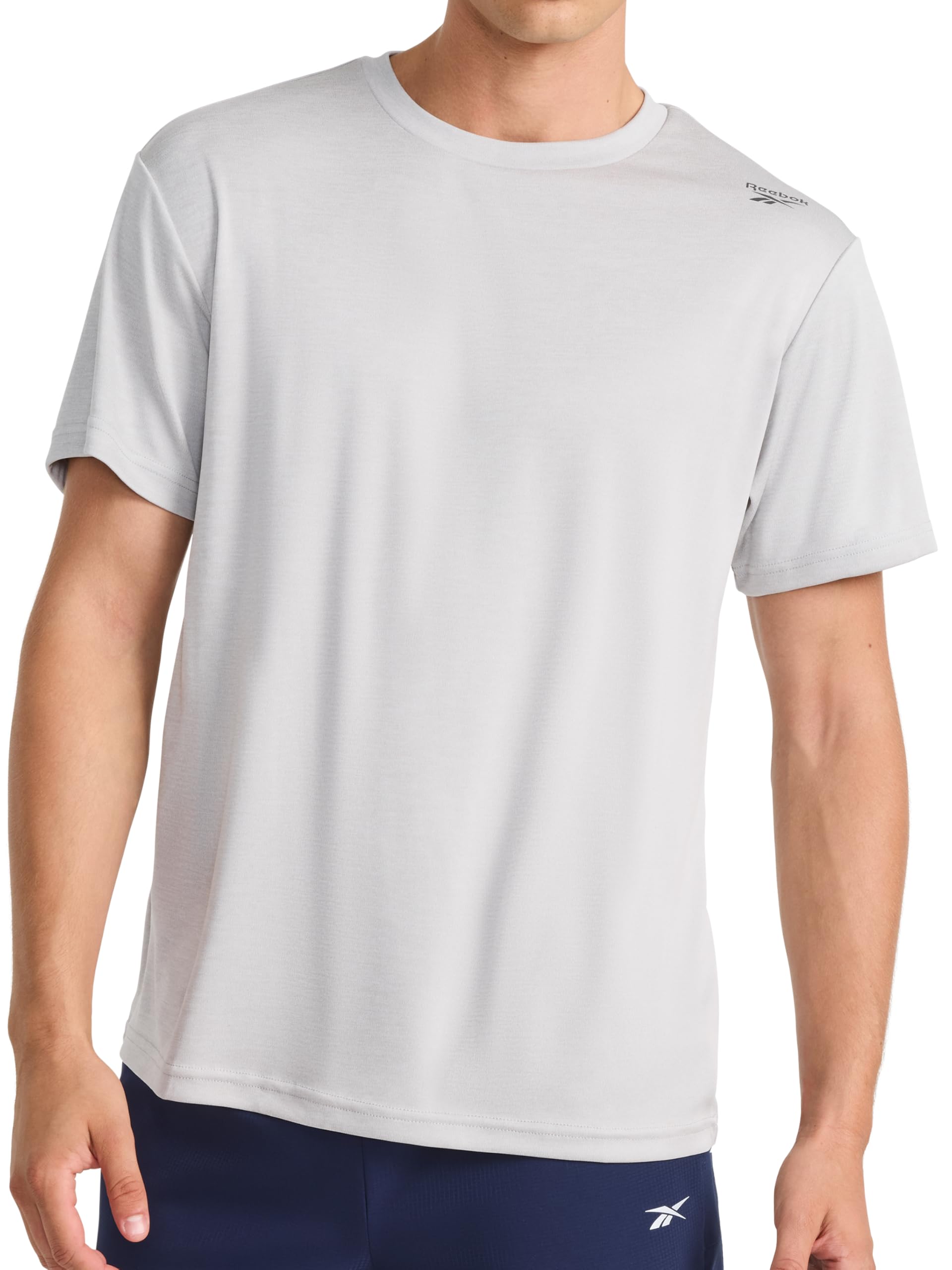 Reebok Men's Small Logo Short Sleeve Crewneck T-Shirt, Standard Fit, Breathable Lightweight Stretch Knit Fabric